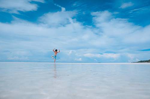 water person standing in body of water man