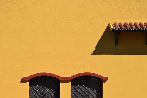 yellow yellow and red painted wall window