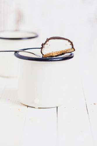cup chocolate biscuit in white mug white