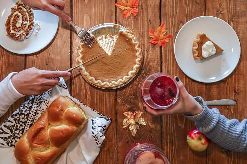 bowl person slicing pie beside bread thanksgiving
