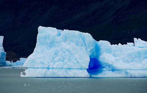 ice iceberg on body of water iceberg