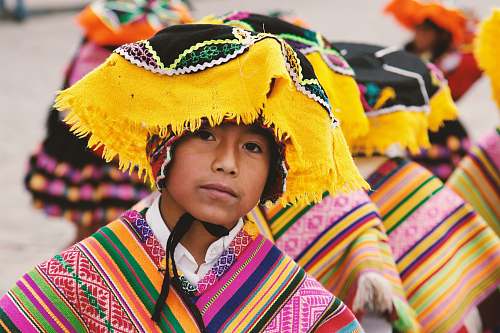 person boy in traditional costume in shallow focus photography people