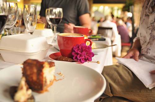 people cappuccino inside red ceramic teacup cup