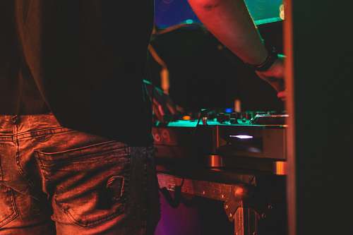 person person wearing denim bottoms dj