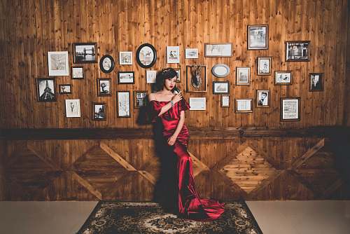 person woman posing while leaning on wall people