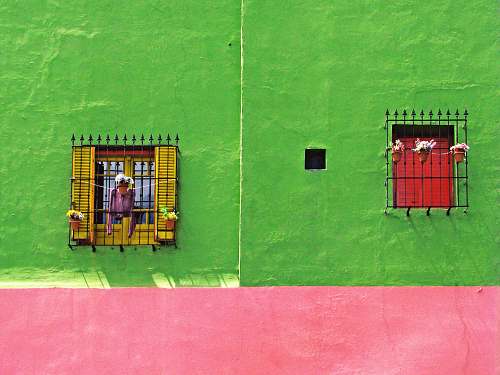 person yellow and green concrete building la boca