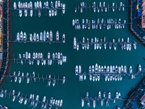 portugal white boats on body of water at daytime drone view