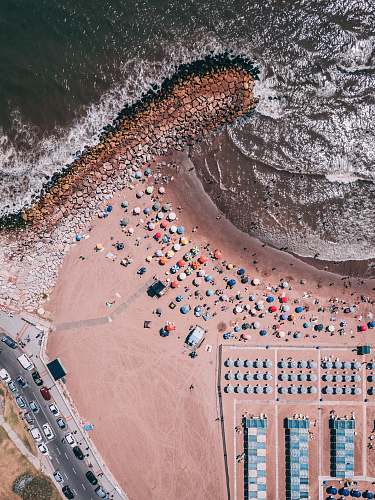 outdoors aerial photography of people near ocean aerial view