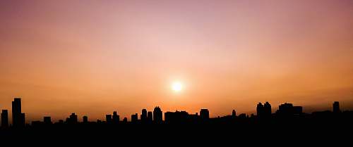 outdoors silhouette photography of building during sunset silhouette