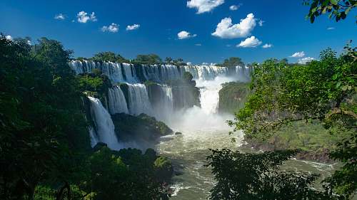 outdoors trees beside waterfalls water