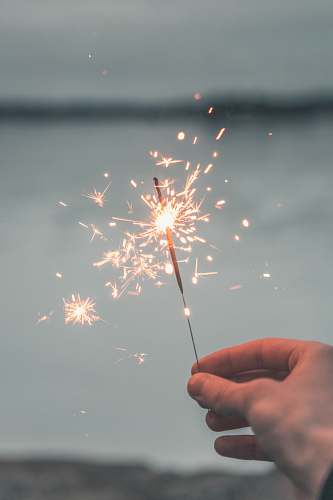 year person holding sparkler stockholm