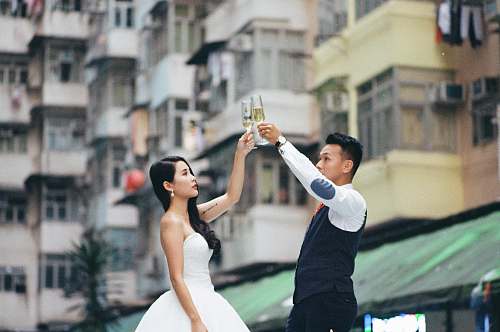 human man and woman raising their arms person