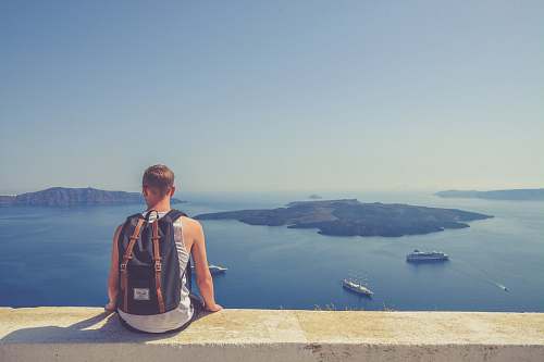 person man sitting facing island human