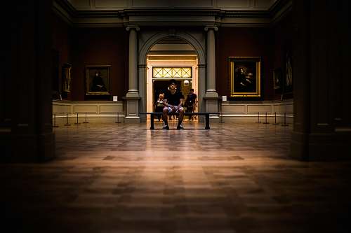 floor man sitting on bench on middle of house interior art
