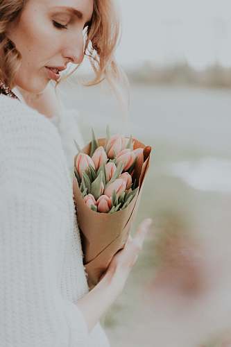 flower woman holding bouquet of pink tulip flowers plant