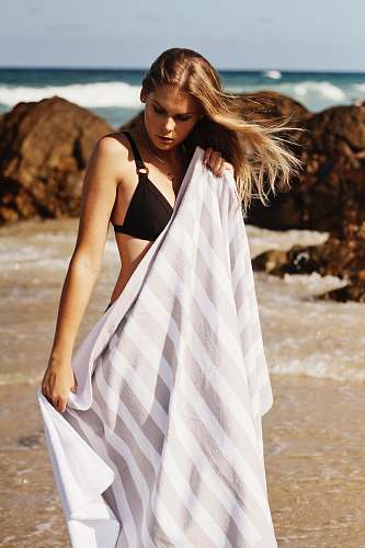 people woman wearing bikini covering body with white cloth human