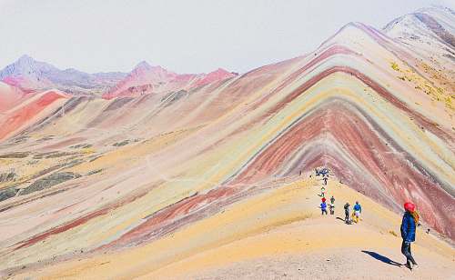 cusco people walking on the mountains during daytime photography rainbow mountain peru