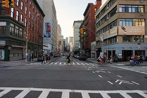 asphalt man riding bicycle at middle of street tarmac