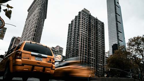 car time lapse photography of cars near buildings transportation