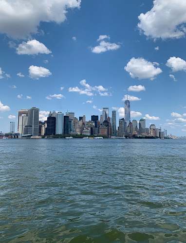 city body of water near high-rise building metropolis