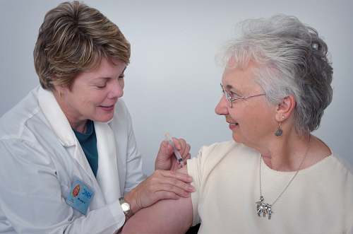human woman inject a woman on left shoulder clothing