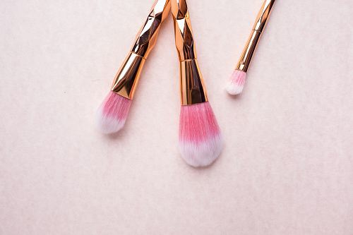 gold-colored makeup brushes