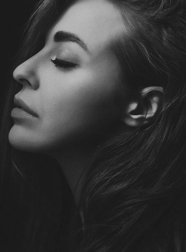 grayscale photography of woman facing sideways