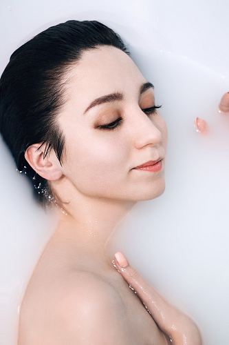 woman bathing in milk