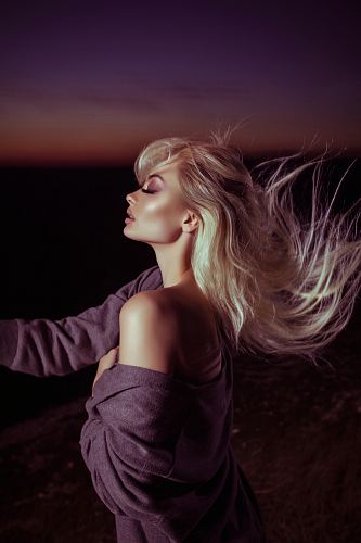 woman wearing gray jacket with blonde hair