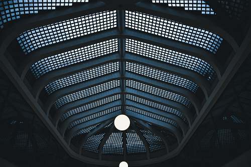 building low angle photography of mesh wall ceiling