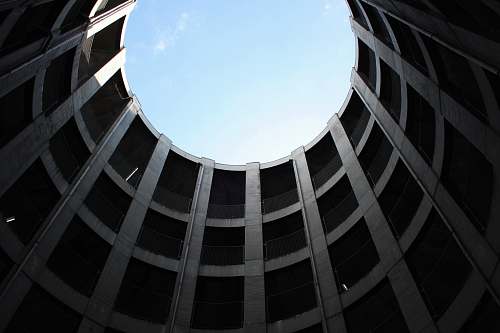 building worm's eye view of building with hole on top window