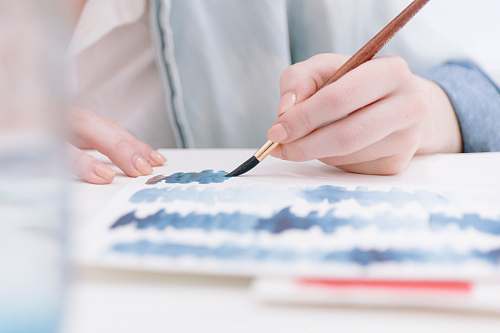 person person holding paint brush creative