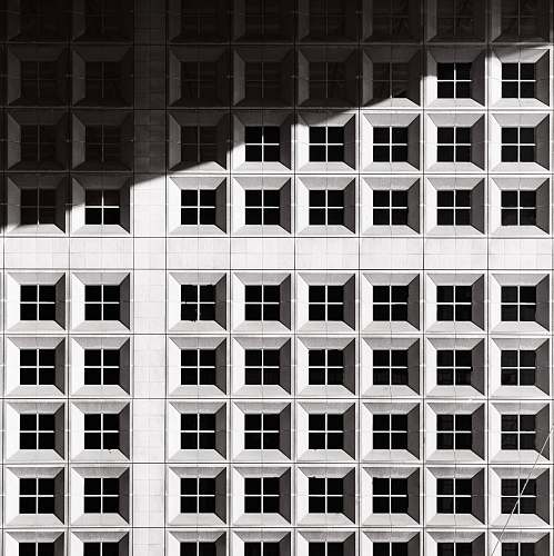 window architectural photography of white building architecture