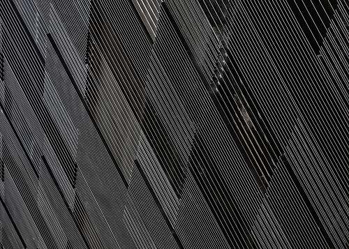building close-up photograph of black concrete wall city