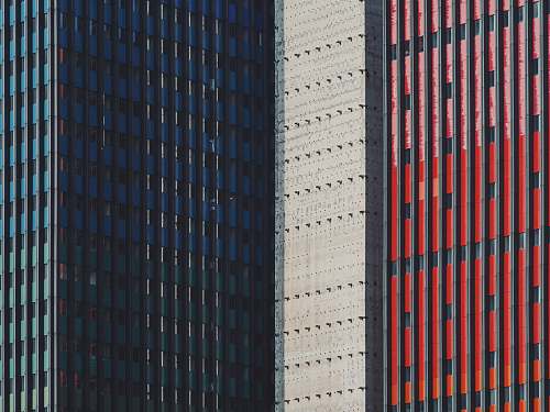 urban blue, white, and red commercial buildings city