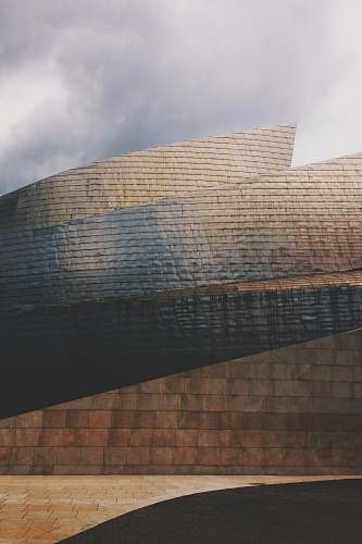 architecture brown concrete wall during daytime bilbao