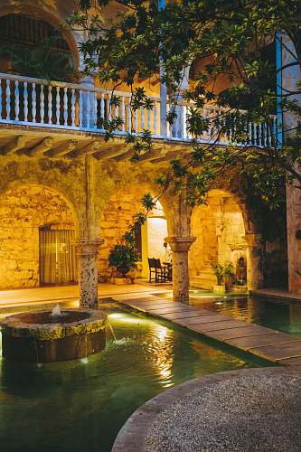 colombia modern house with water fountain and swimming pool showing lighted ceiling lights water