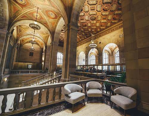 interior three fabric chairs near balustrade furniture