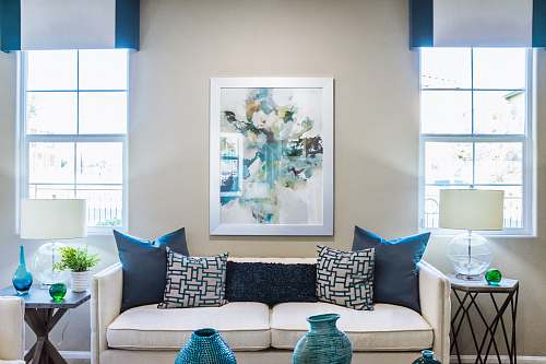vase couch near painting couch