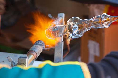 flame photo of glass vase molding burner