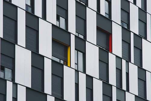 brown architectural photograph of glass wall building grey