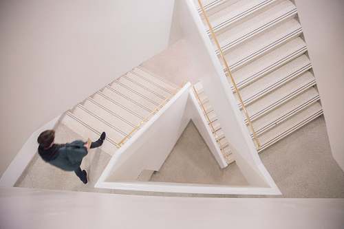 stairwell walking person on white concrete stairs guggenheim