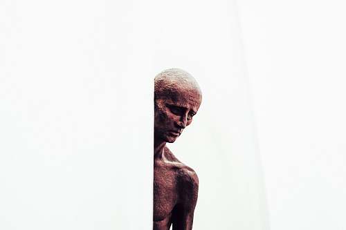 sculpture man on white wall person
