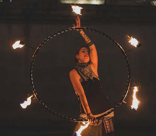 person woman fire dancing at night juggling