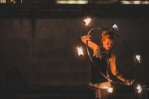 person woman playing fire dance fire