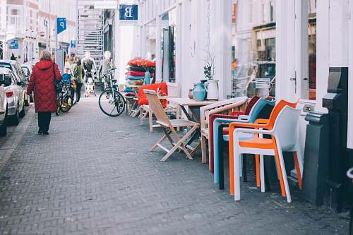 chair woman walking on sidewalk furniture