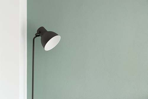 minimal black floor lamp at the corner wall