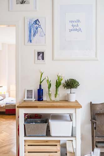 furniture white and brown wooden end table near wall inside room interior design