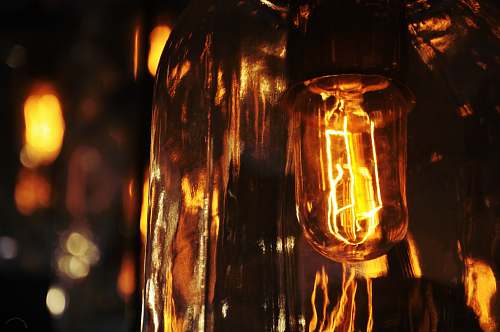 bulb closed up photo of orange lightened lamp filament