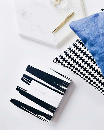 desk gray retractable pen beside blue textile white